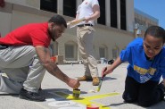 Volunteers brighten playground at Hopkins Lloyd School